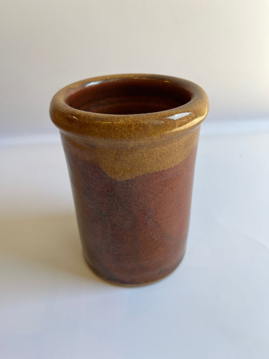 Cylindrical brown glazed vase with defined rim