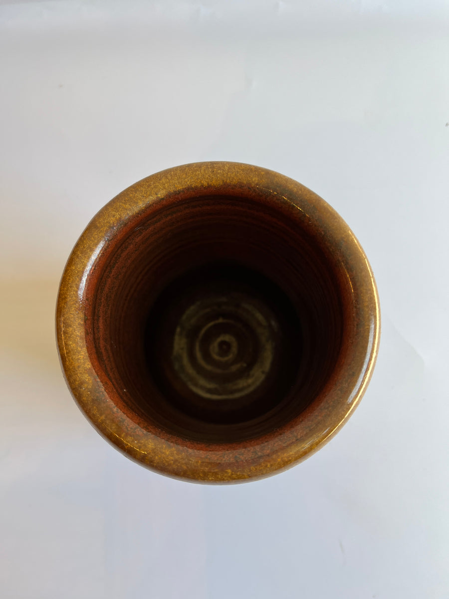 Overhead view of Cylindrical brown glazed vase with defined rim looking inside